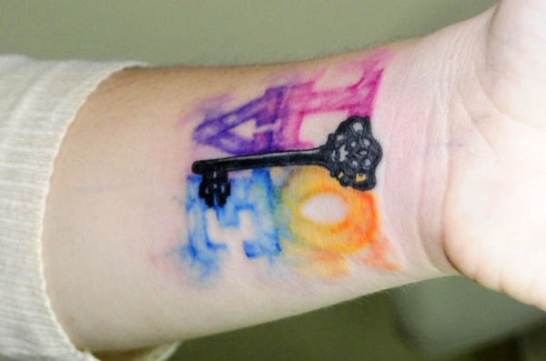 Love is the key to every problem in life so is the water color love tattoo along with a key tattoo design.