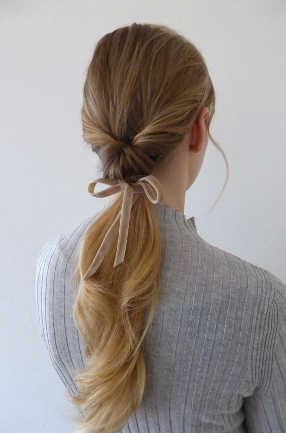 Low twisted ponytail with velvet ribbon. Valentine’s Day Hairstyles