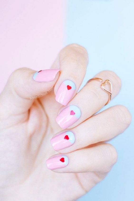Ombre nails with little hearts.