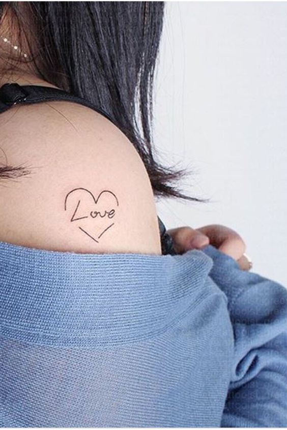 Simple love tattoo on shoulder.