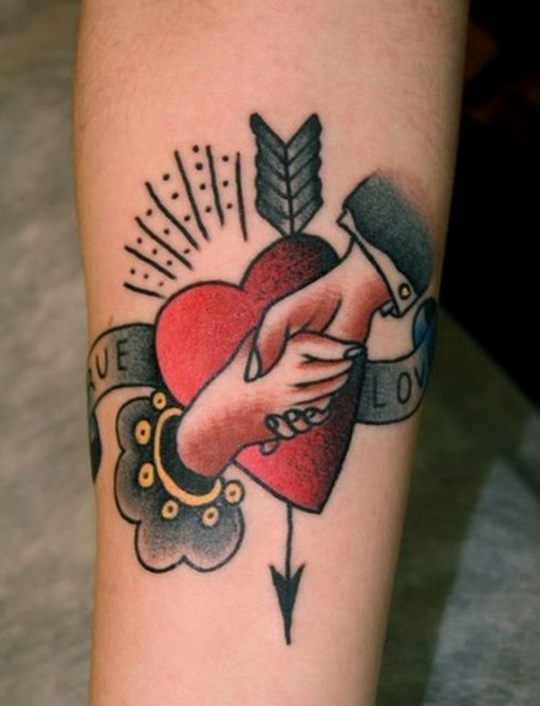 This hand shaking tattoo along design with heart as background says a lot no more words.