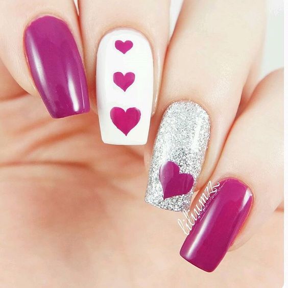 Triple hearts nail design for special day.