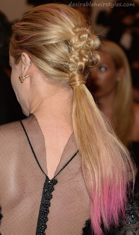 Twisted bow ponytail with pink highlights.