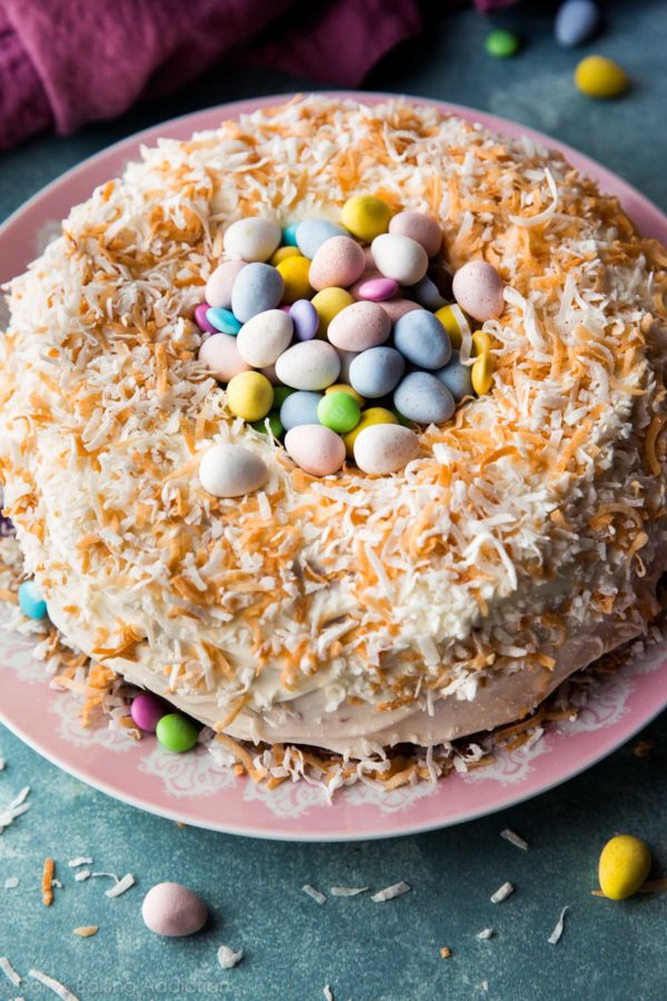 A lemon bundt cake turned into a nest of Easter candy with creamy coconut frosting