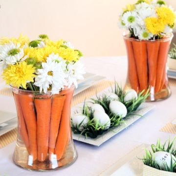 Adorable carrot centerpiece with fresh flowers.