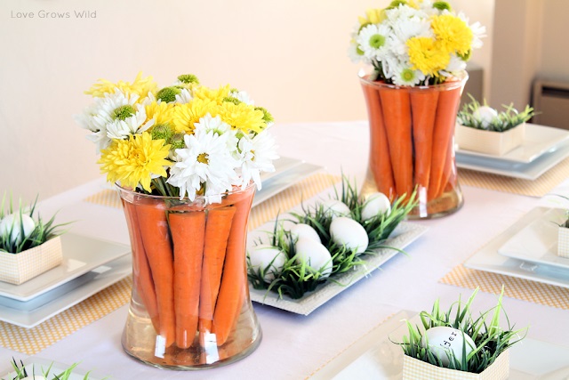 Adorable carrot centerpiece with fresh flowers.