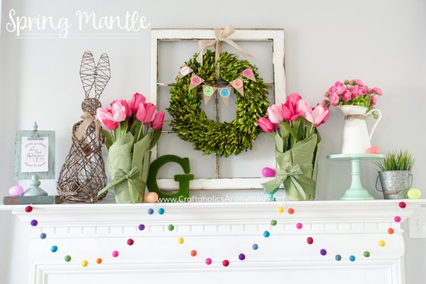 Colorful Easter mantel decor with wire bunny, tulip and pom-pom garland.
