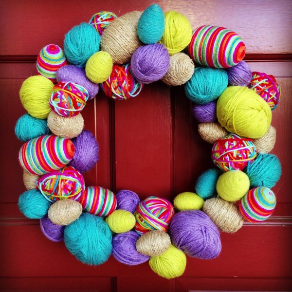 Colorful yarn easter egg wreath.