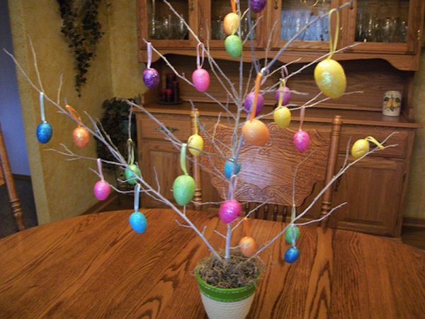 Potted tree with sparkled eggs.