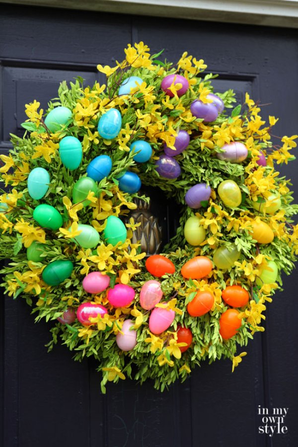 Spring easter wreath with colorful plastic eggs.