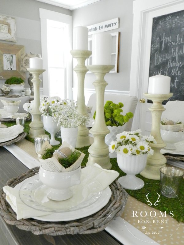 Vintage-inspired place settings to the daisies and white candlesticks.