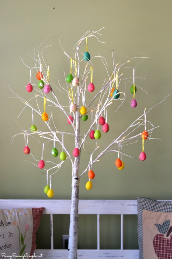 White branches decorated with colored Easter eggs.