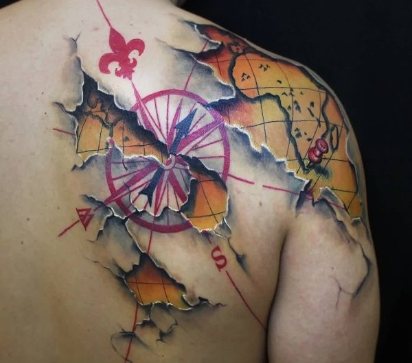 3D ripped map tattoo on back shoulder.