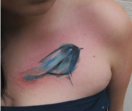 Abstract blue bird tattoo.