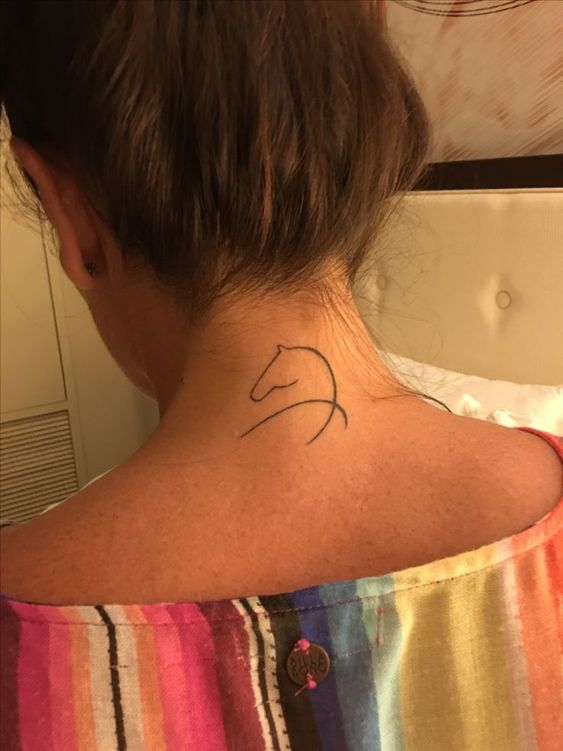 Awesome fineline horse tattoo on upper neck.