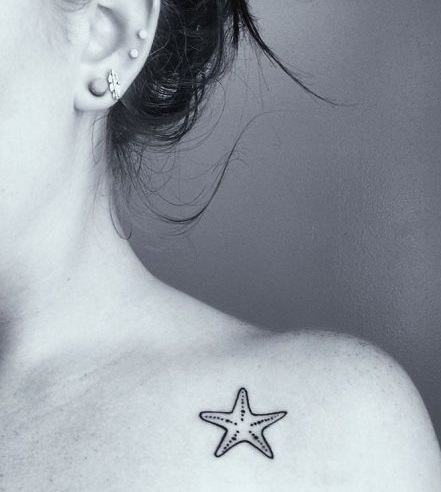 Beautiful starfish tattoo on shoulder.