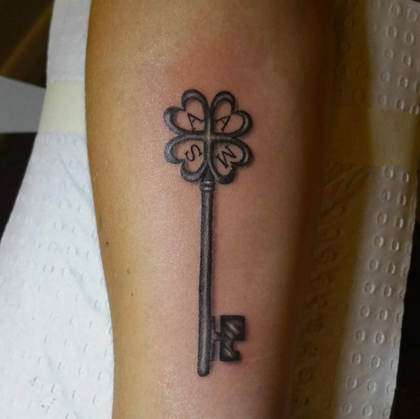 Best family key tattoo design with initials.