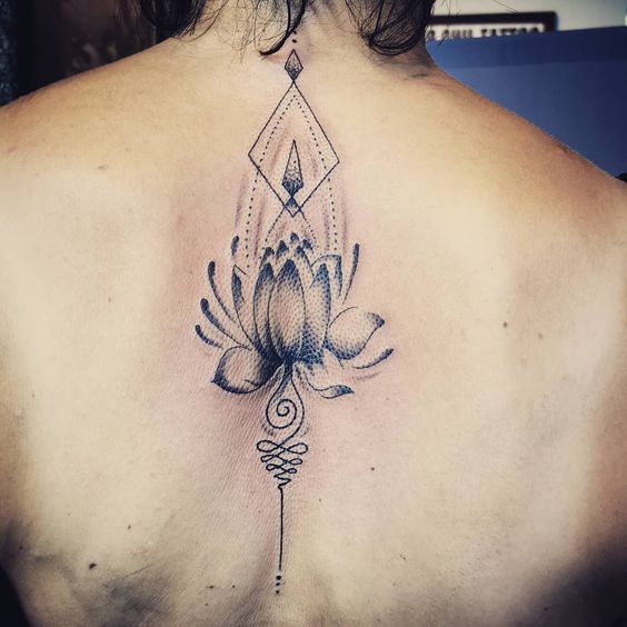 Black and grey mandala lotus tattoo on back.