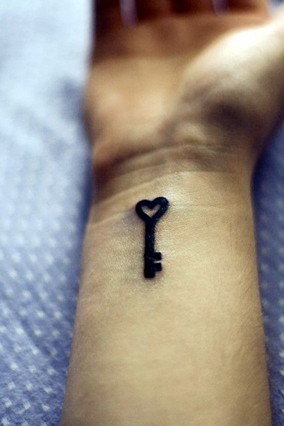 Black bold key tattoo for wrist.