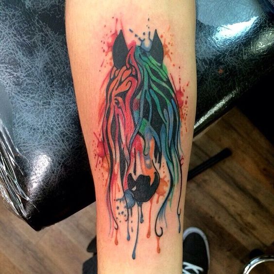 Charming watercolor horse tattoo for lower leg.