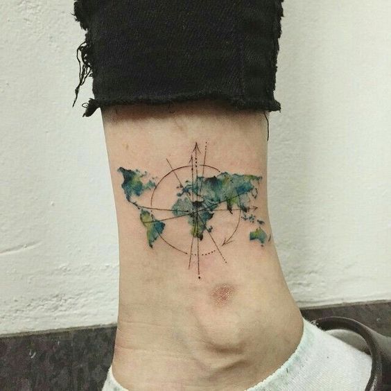Chic world map tattoo on ankle.