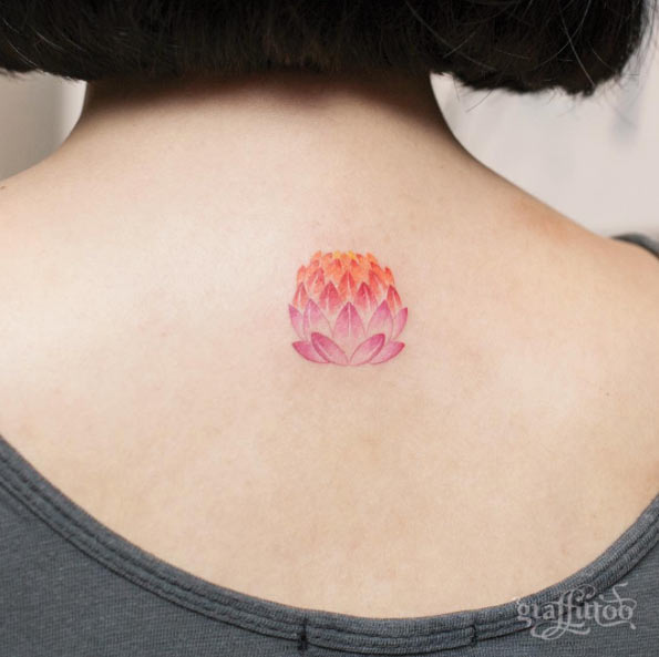 Colorful lotus lamp on upper back.