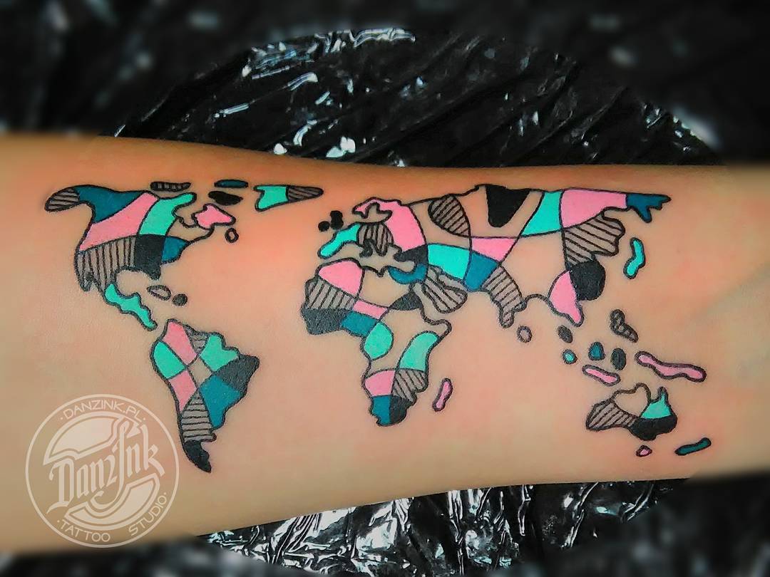 Cool colorful tone world map tattoo for inner arm.
