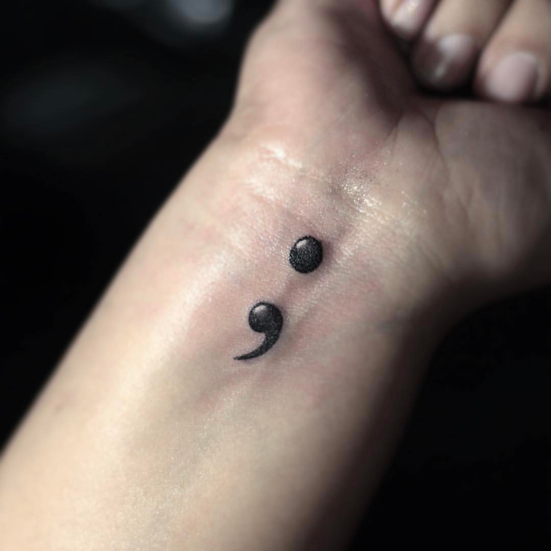 Cool idea to opt semicolon tattoo on wrist.