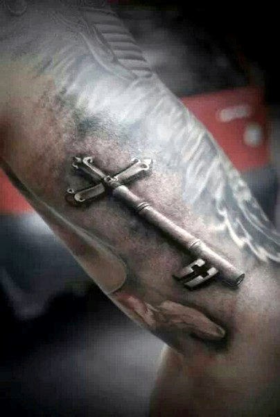 Cross as key tattoo design for men.
