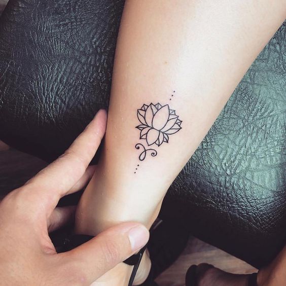 Fineline lower leg lotus tattoo idea.