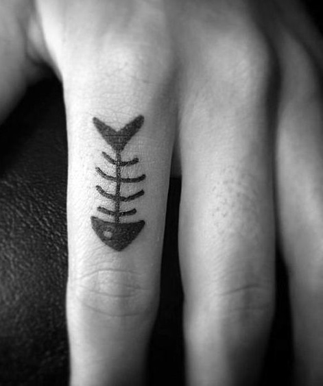 Fish skeleton tattoo on finger.