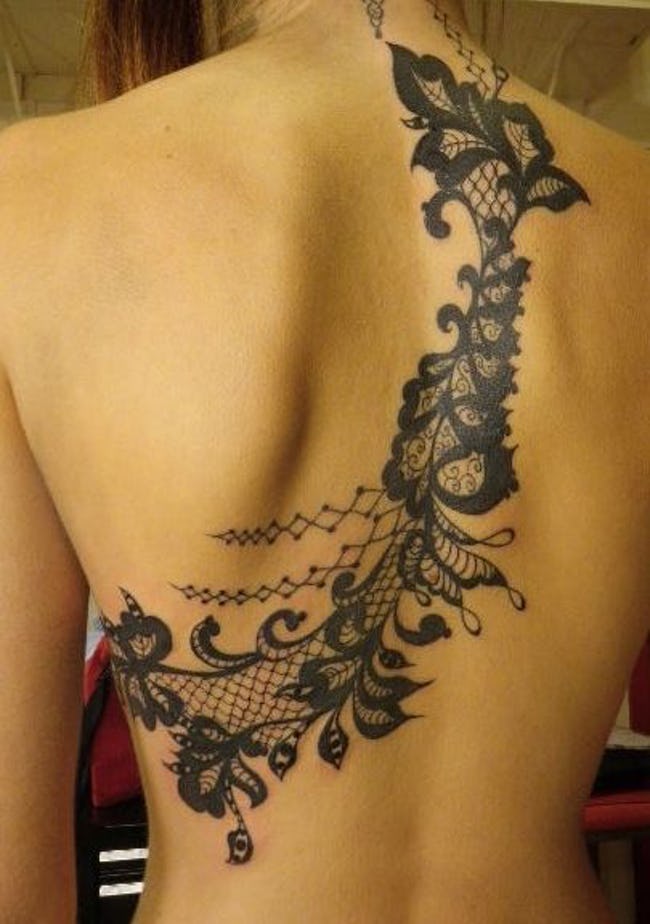 Flowers with lace tattoo look incredible on back.