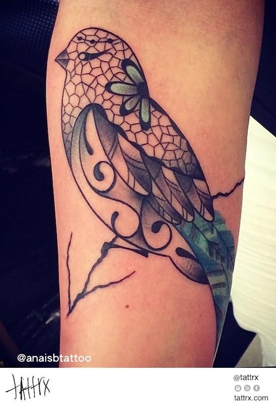 Geometric bird tattoo on hand.