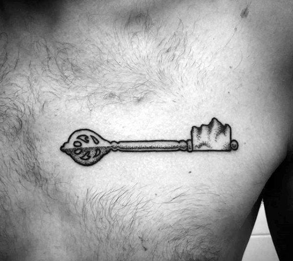Grey dot work key tattoo on chest for men.