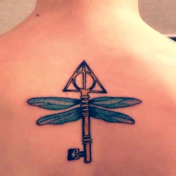 Harry Potter inspired key tattoo on back.