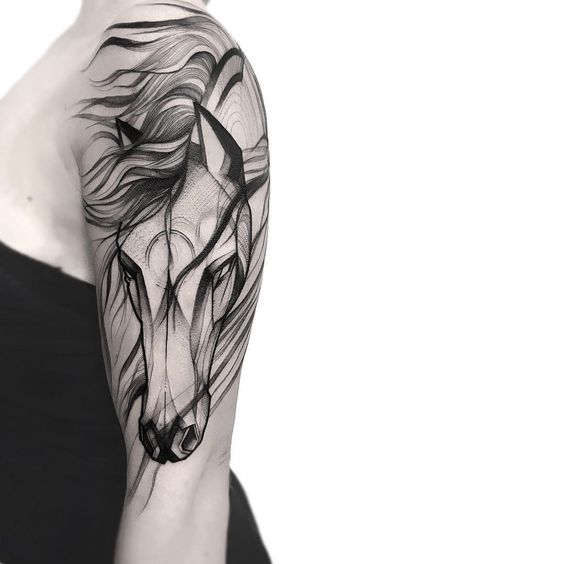 Incredible horse tattoo on upper arm.