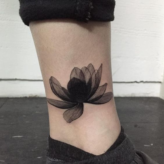 Incredible lotus tattoo on lower leg.