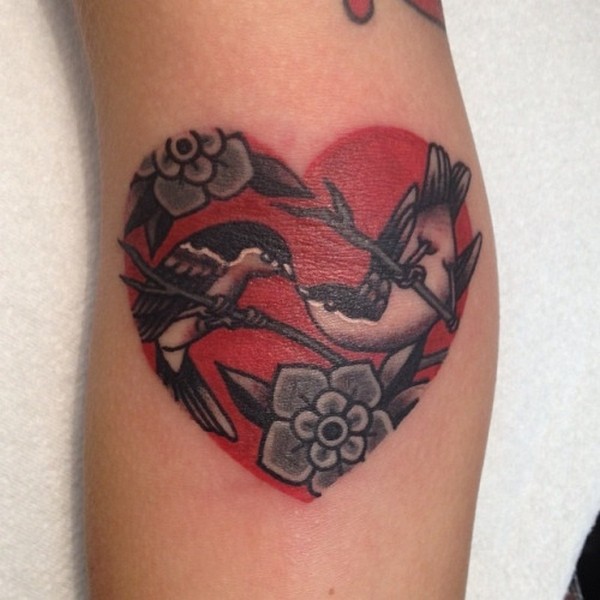 Incredible love bird heart tattoo design.