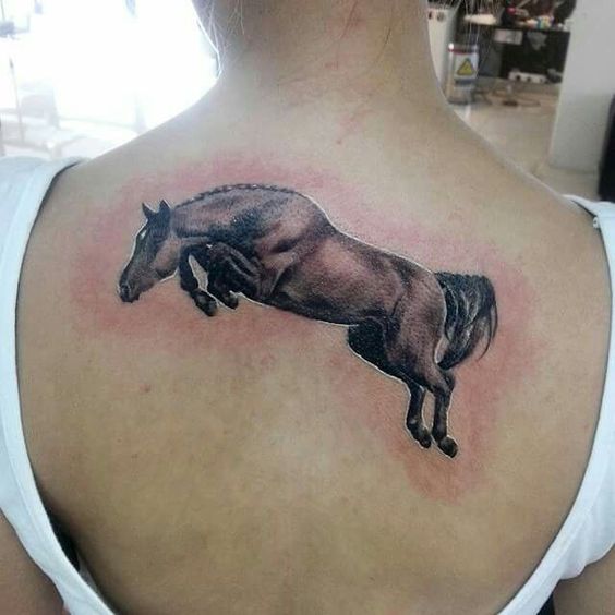 Jumping horse tattoo represent strength and power.
