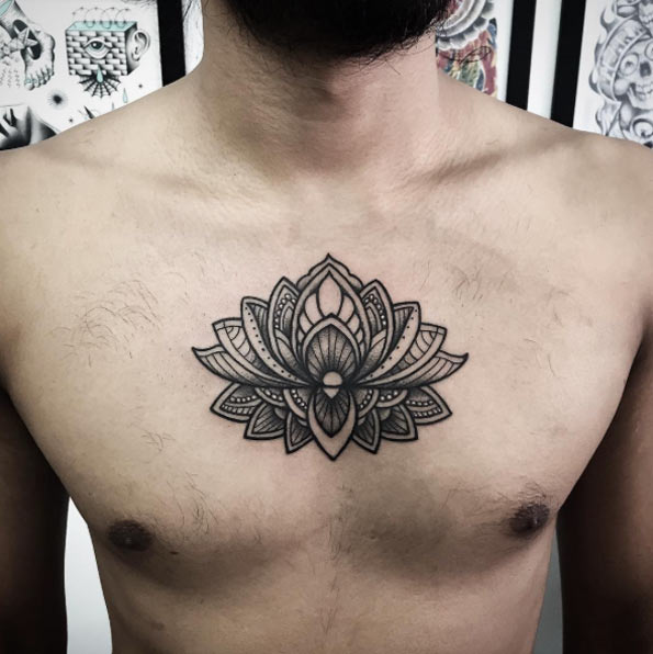 Mandala sternum lotus tattoo for men.