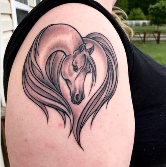 Marvelous linework horse tattoo for upper arm.