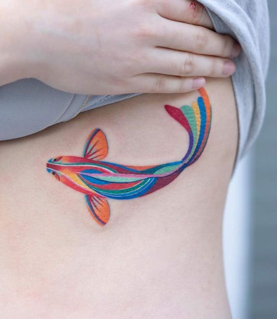 Muticolor fish tattoo.