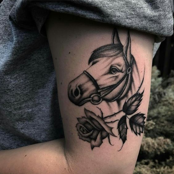Nice idea to ink horse tattoo with flowers.