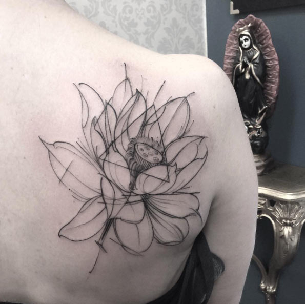 Perfect outline lotus on back shoulder.