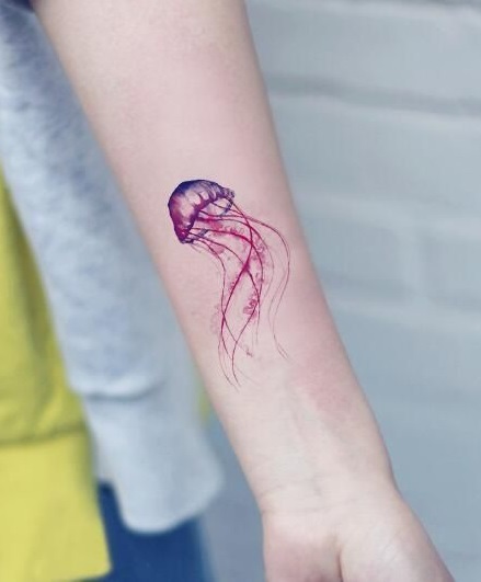 Pink jelly fish tattoo.
