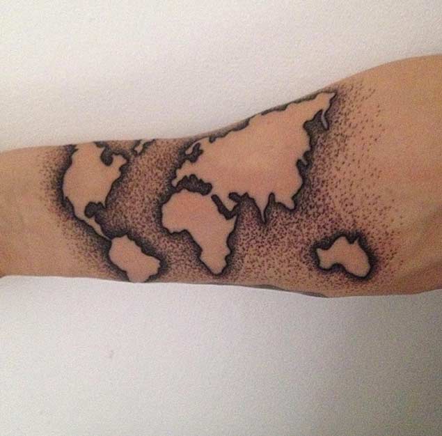 Pretty dot work world map tattoo for upper arm.