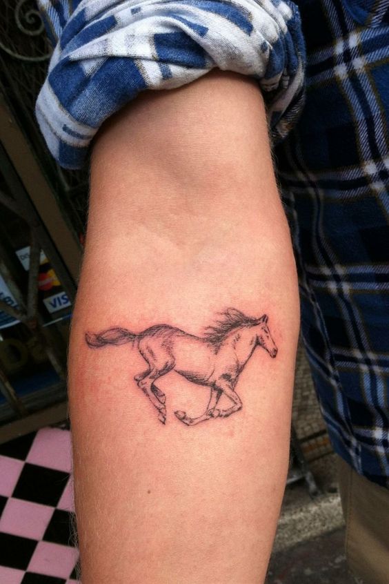 Pretty running horse tattoo.