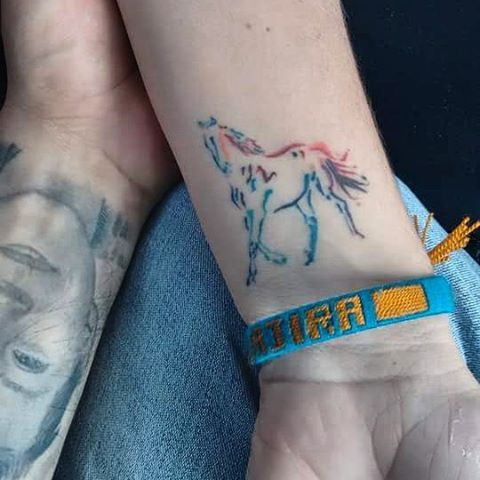 Rainbow horse tattoo design for wrist.