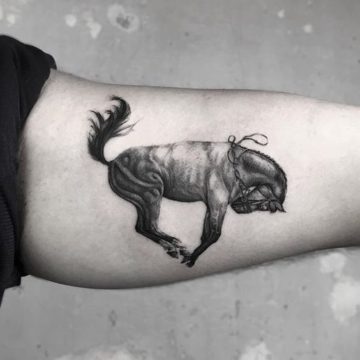 Running horse tattoo can be opt for both man and women.