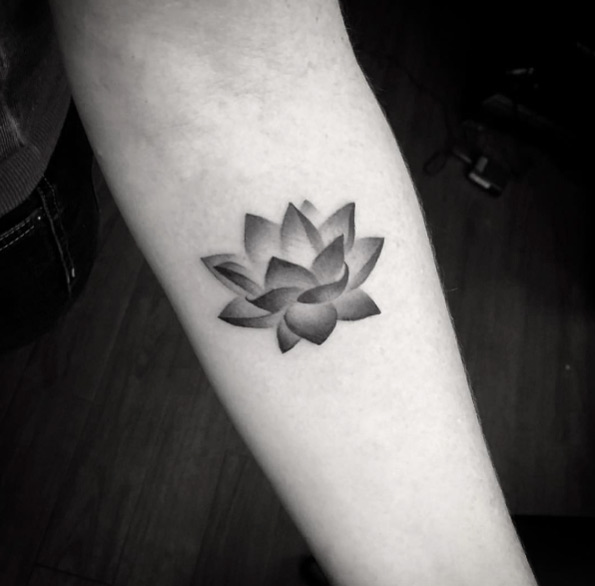 Shaded lotus flower forearm tattoo.
